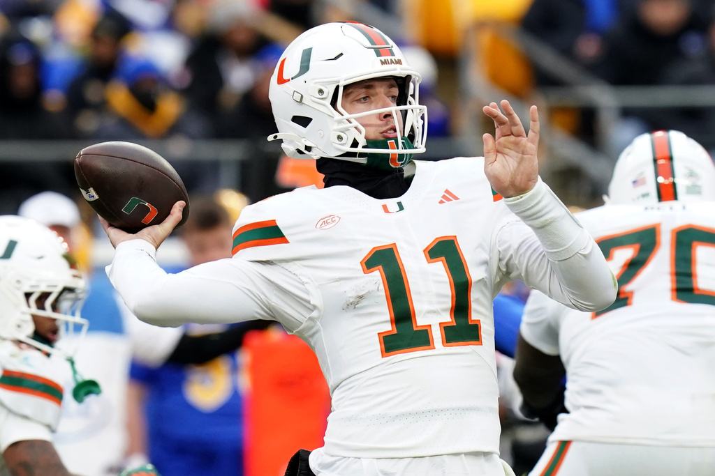 Miami quarterback Carson Beck (11) throws during the second half of an NCAA college football game against Pittsburgh, Saturday, Nov. 29, 2025, in Pittsburgh. (AP Photo/Matt Freed)