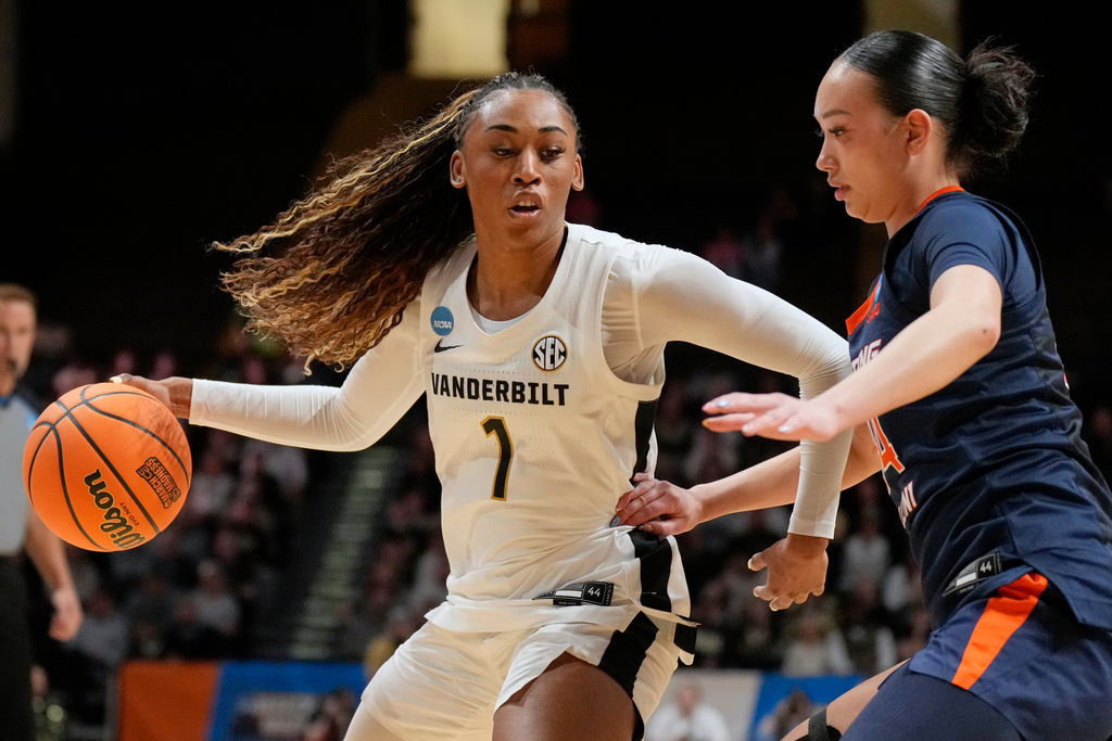 Vanderbilt guard Mikayla Blakes (1) dribble the ball past Illinois guard Maddie Webber, right, during the first half in the second round of the NCAA college basketball tournament Monday, March 23, 2026, in Nashville, Tenn. (AP Photo/George Walker IV)