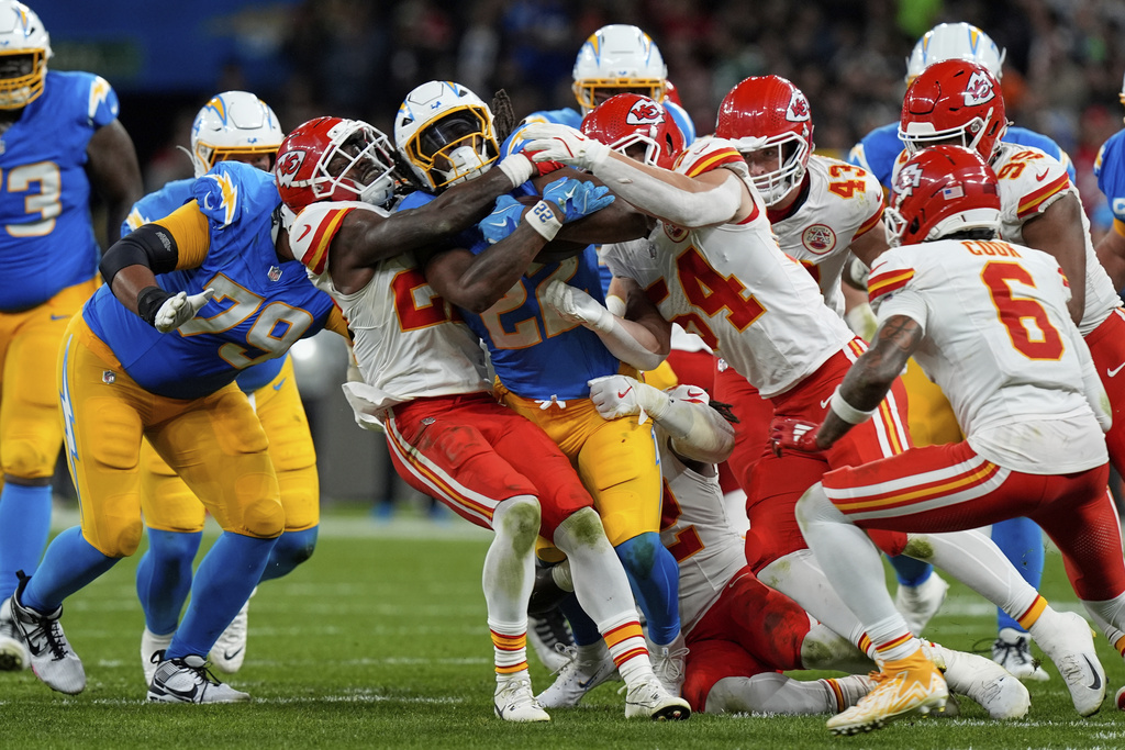 Los Angeles Chargers running back Najee Harris is tackled by the Kansas City Chiefs during the second half of an NFL football game, Friday, Sept. 5, 2025, in Sao Paulo. (AP Photo/Fernando Llano)
