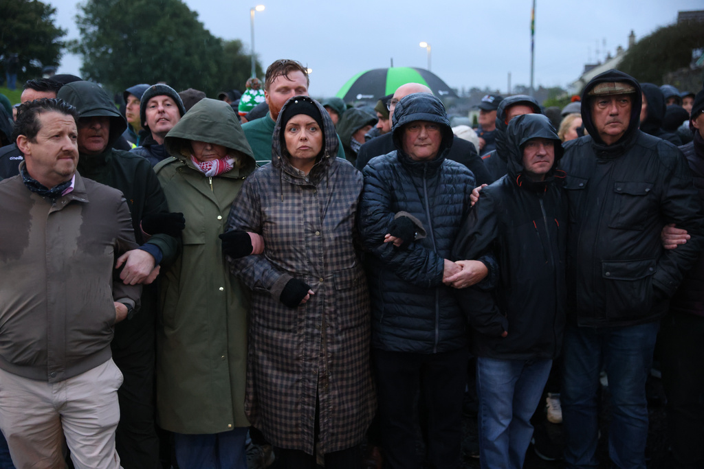 Protesters block the Garvaghy road ahead of a Portadown District Loyal Orange Lodge (LOL) No 1 march in the first parade for almost 30 years, after the parade was given clearance in a late-night hearing, in Portadown, Northern Ireland, Sunday, Sept. 27, 2026. (Peter Morrison/PA via AP)