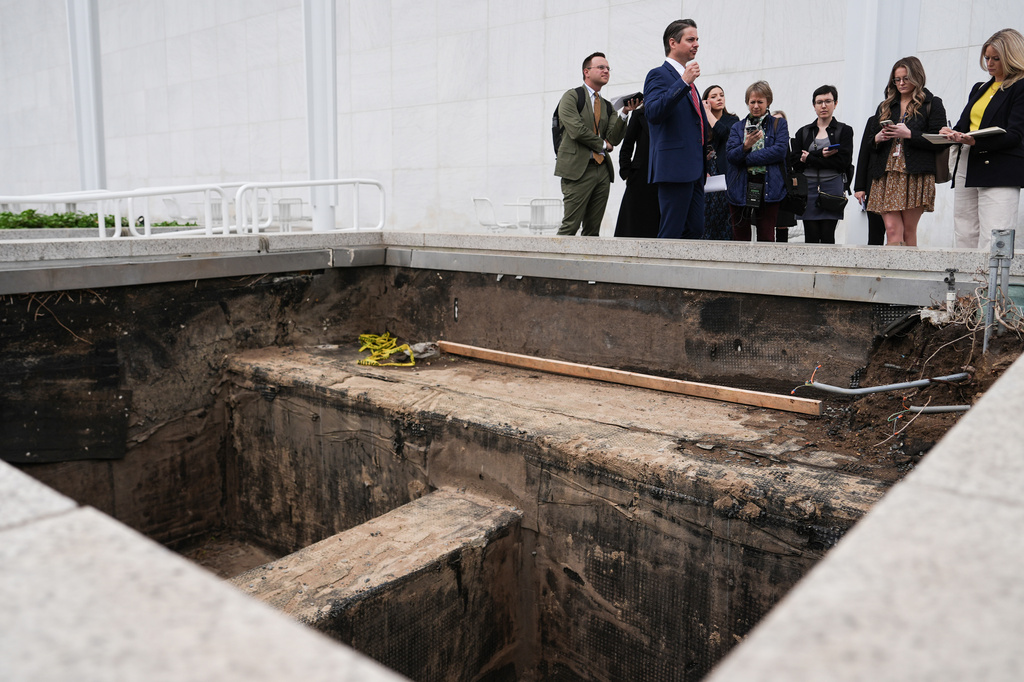 Matt Floca, the John F. Kennedy Center for the Performing Arts' new executive director and chief operating officer, shows an expansion joint during a media tour intended to show building damage, Wednesday, April 22, 2026, in Washington. (AP Photo/Julia Demaree Nikhinson)