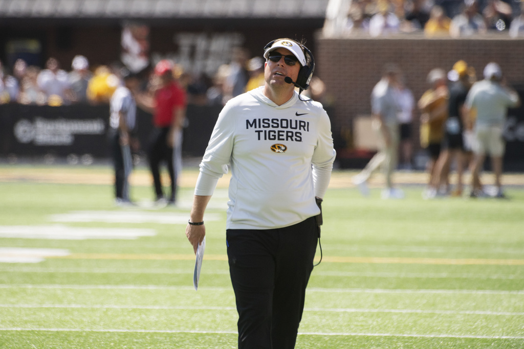 Missouri head coach Eliah Drinkwitz walks the sidelines during the first half of an NCAA college football game against Louisiana-Lafayette Saturday, Sept. 13, 2025, in Columbia, Mo. (AP Photo/L.G. Patterson)