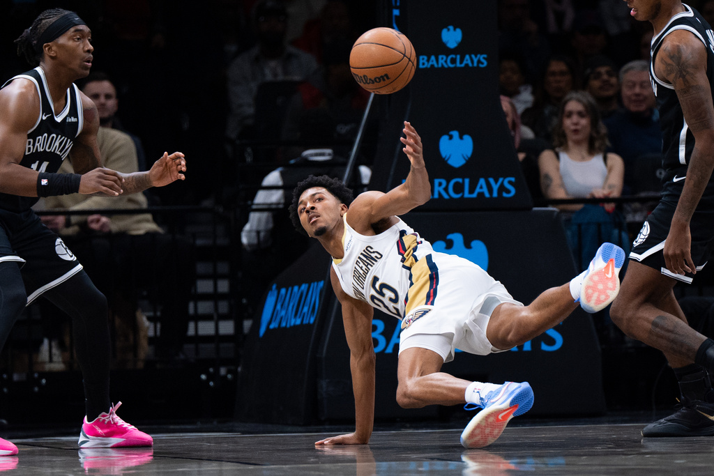 New Orleans Pelicans forward Trey Murphy III (25) trips and loses control of the ball during the first half of an NBA basketball game against the Brooklyn Nets, Saturday, Dec. 6, 2025, in New York. (AP Photo/Angelina Katsanis)