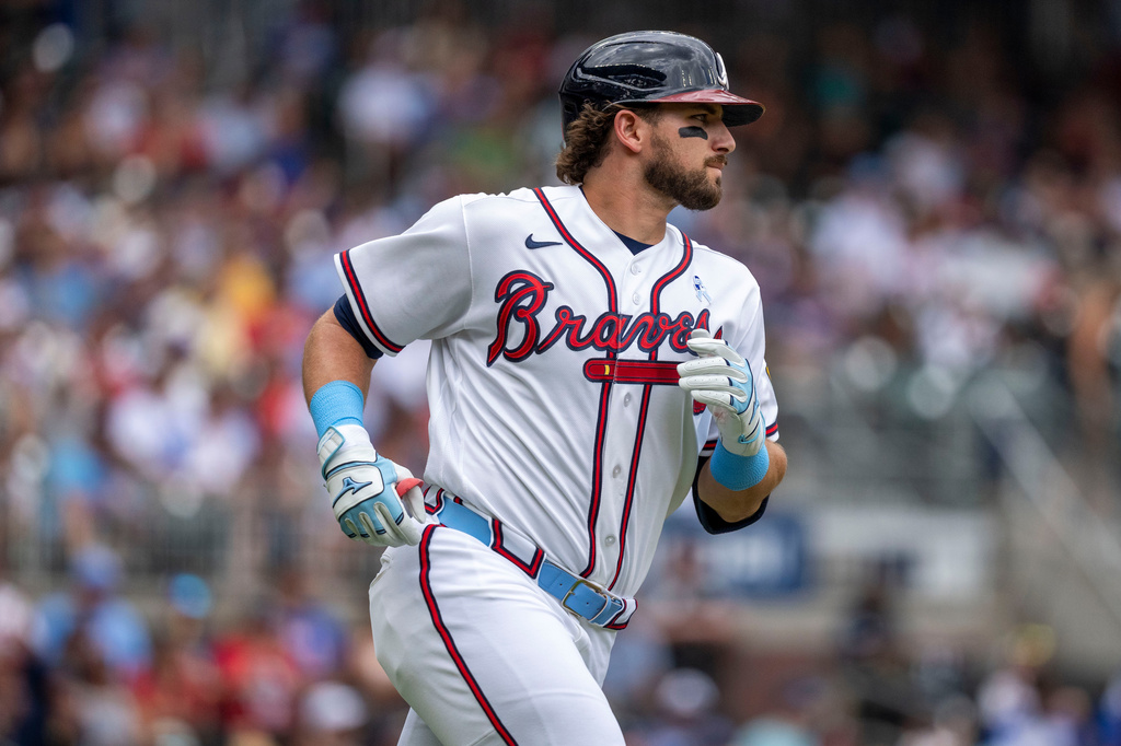 Atlanta Braves third baseman Austin Riley runs to first on a base hit during the second inning of a baseball game against the Milwaukee Brewers, Sunday, June 21, 2026, in Atlanta. (AP Photo/Erik Rank)