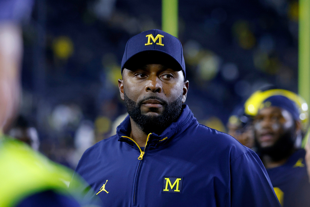 FILE - Michigan coach Sherrone Moore walks off the field following an NCAA football game Aug. 30, 2025, in Ann Arbor, Mich. (AP Photo/Al Goldis, File)