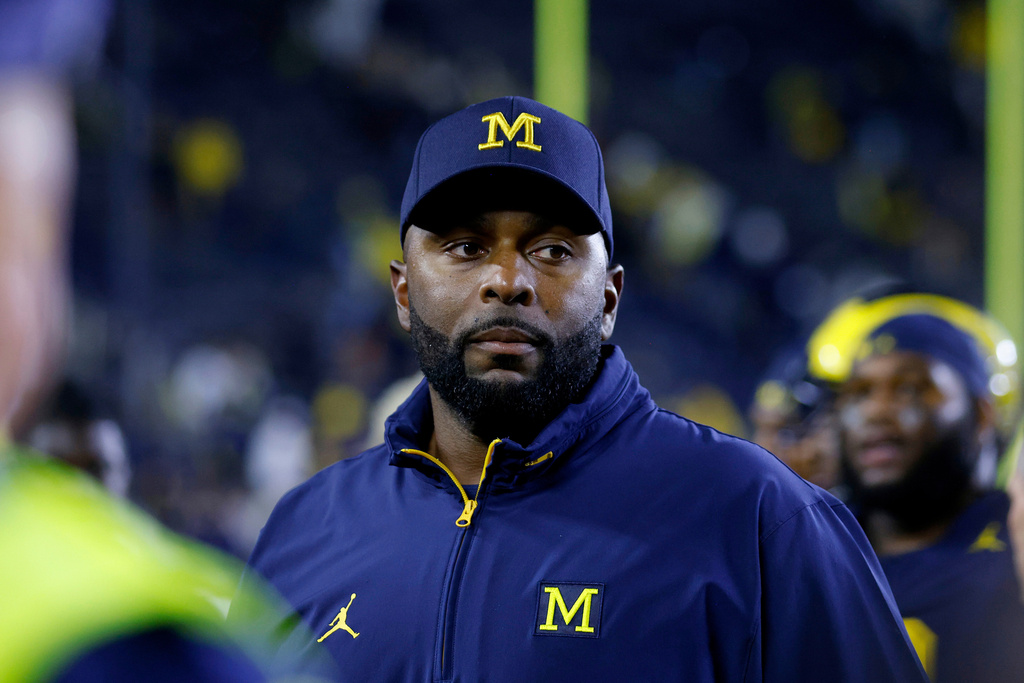 FILE - Michigan coach Sherrone Moore walks off the field following an NCAA football game Aug. 30, 2025, in Ann Arbor, Mich. (AP Photo/Al Goldis, File)