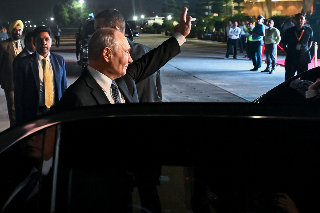 Russian President Vladimir Putin waves, standing by a limousine, upon his arrival for the BRICS Summit in New Delhi, India, on Friday, Sept. 11, 2026. (Kristina Solovyova, Sputnik, Kremlin Pool Photo via AP)