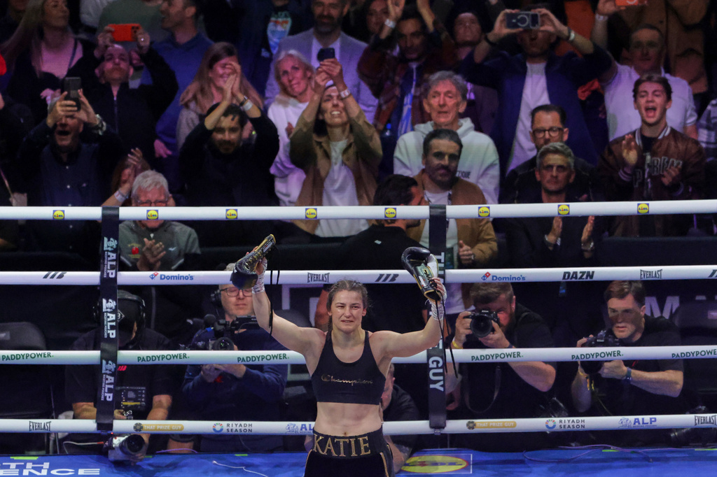 Ireland's Katie Taylor celebrates after beating Flora Pili of France in their super lightweight world title fight in Dublin, Saturday, Sept. 5, 2026. (AP Photo/Peter Morrison)