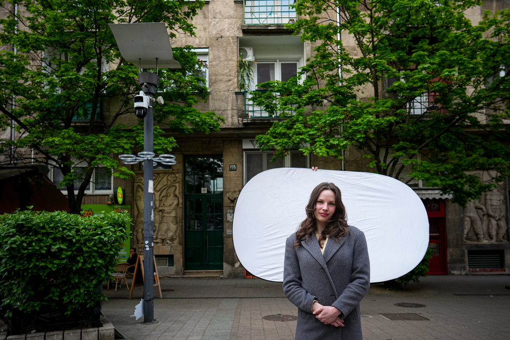 Dori Szaday, 22, poses for a portrait in Budapest, Hungary, Monday, April 13, 2026. "There's a belief that Hungarians are willing to put up with anything. We finally proved that wrong." (AP Photo/Petr David Josek)