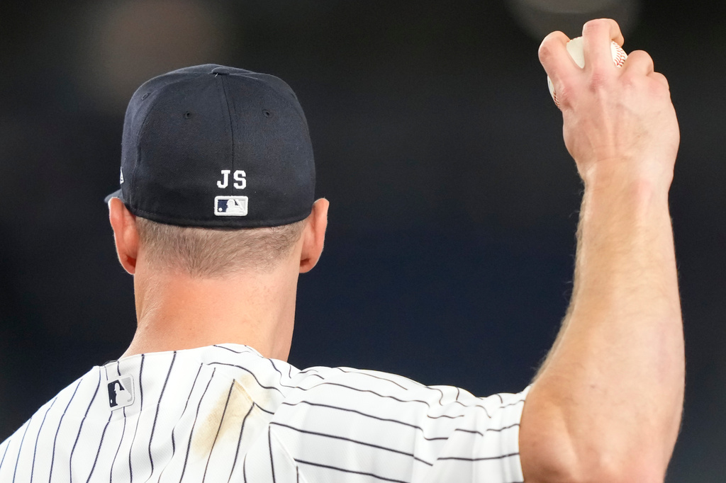 New York Yankees' cap is stitched with "JS" in tribute to retired New York Yankees broadcaster John Sterling during the ninth inning of a baseball game between the New York Yankees and the Baltimore Orioles, Monday, May 4, 2026, in New York. (AP Photo/Yuki Iwamura)