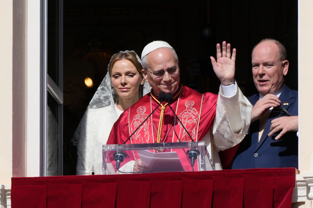 Pope Leo XIV, Princess Charlene of Monaco and Prince Albert II of Monaco appear at the Gallery of Hercules balcony at the Prince's Palace in Monaco-Ville, Monaco, Saturday, March 28, 2026.(AP Photo/Gregorio Borgia)