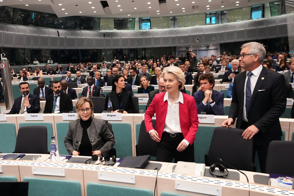 From left, European Commissioner for Financial Services Maria Luis De Albuquerque, European Commission President Ursula von der Leyen and European Commissioner for Internal Affairs and Migration Magnus Brunner arrive for a Conference of the Global Alliance to Counter Migrant Smuggling at the EU Charlemagne building in Brussels, Wednesday, Dec. 10, 2025. (AP Photo/Virginia Mayo)
