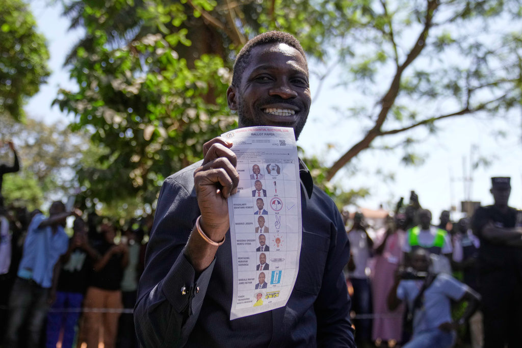 Uganda opposition presidential candidate Robert Kyagulanyi Ssentamu, famously known as Bobi Wine of the National Unity Platform (NUP), casts his vote during the presidential election at a polling station, in Kampala, Uganda, Thursday, Jan. 15, 2026. (AP Photo/Brian Inganga)