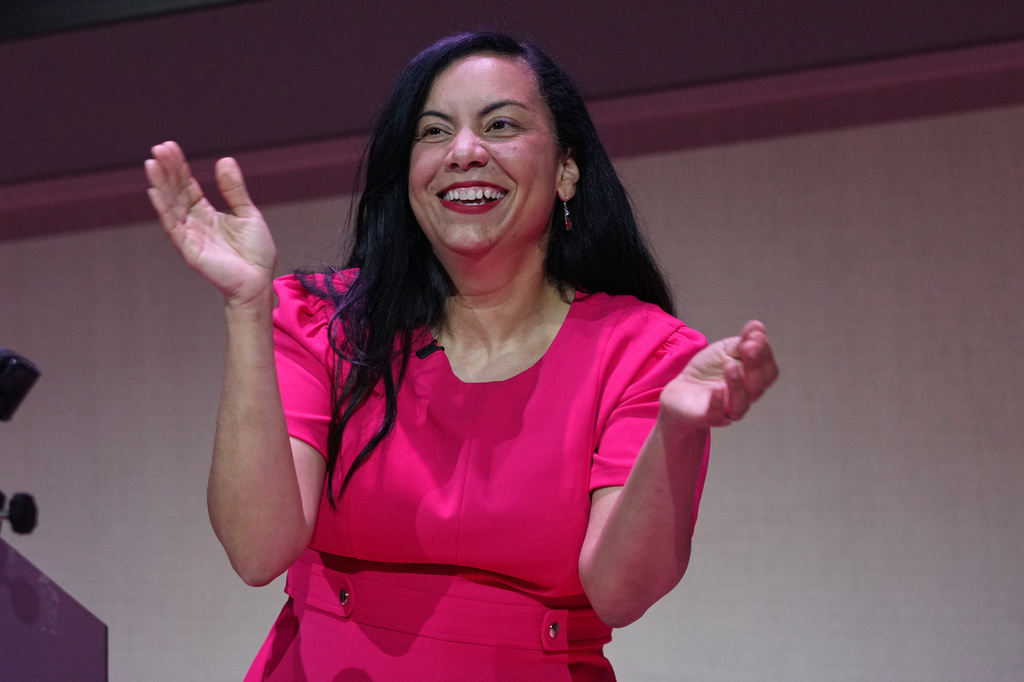 Analilia Mejia smiles as she gestures to supporters after winning New Jersey's 11th Congressional District special election, Thursday, April 16, 2026, in Montclair, N.J. (AP Photo/Frank Franklin II)