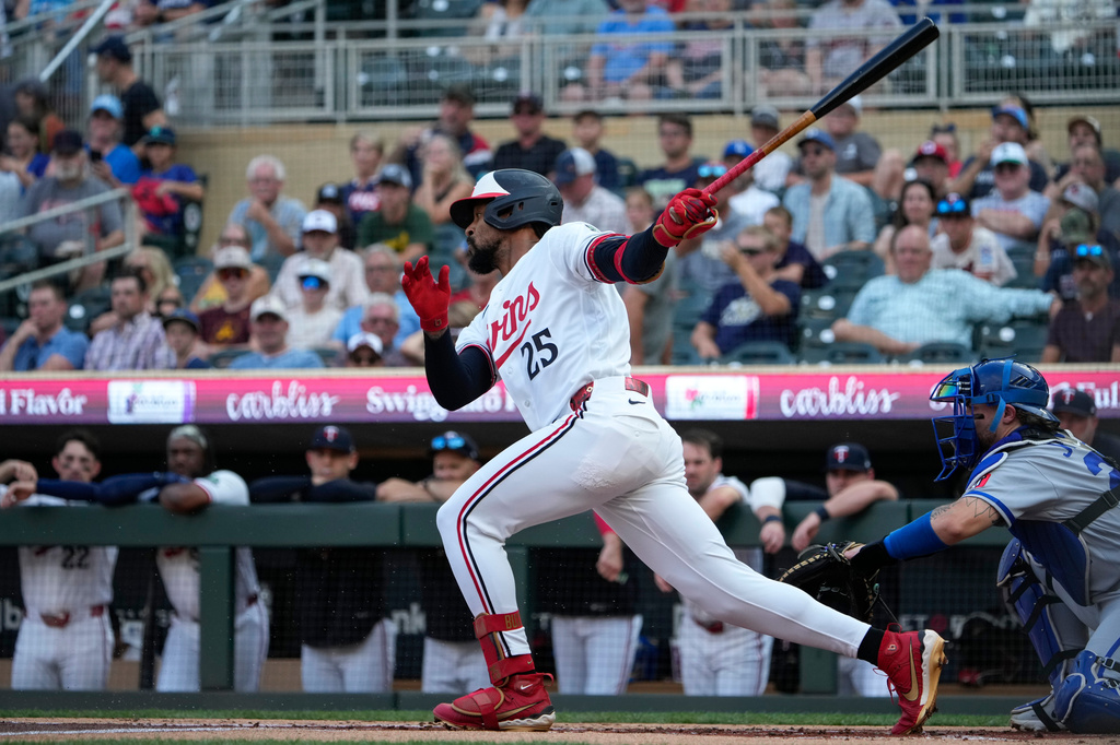 Minnesota Twins' Byron Buxton (25) advances towards first base after hitting a single in the first inning of a baseball game against the Kansas City Royals, Tuesday, July 28, 2026, in Minneapolis. (AP Photo/Joseph Scheller)