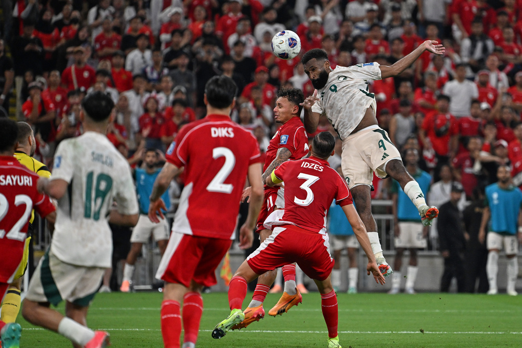 Saudi Arabia's Feras Albrikan, right, heads the ball to scores his side's third goal during the World Cup 2026 Asian qualifier fourth-round Group B soccer match between Saudi Arabia and Indonesia at Alinma Bank Stadium in King Abdullah Sports City, in Jiddah, Saudi Arabia, Wednesday, Oct. 8, 2025. (AP Photo)