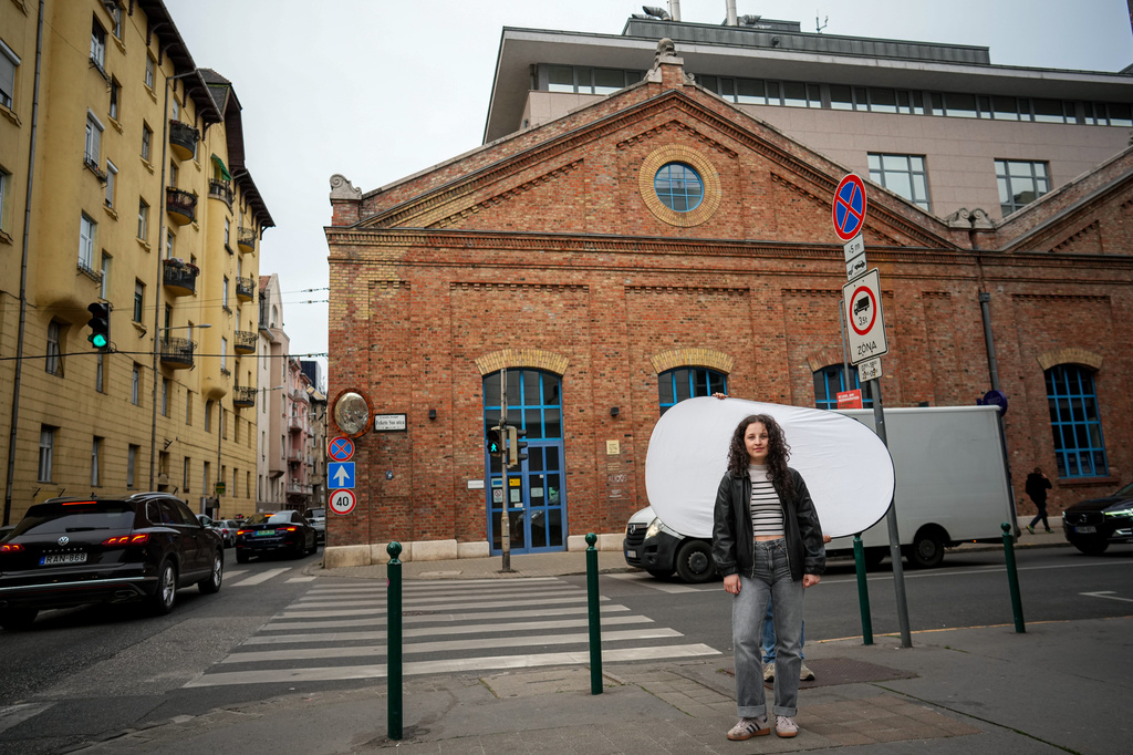 Mira Nagy, 19, poses for a portrait in Budapest, Hungary, Monday, April 13, 2026. "I listened a lot of podcasts, I did my research and I figured out that staying in power for sixteen years was not okay. That defeats the point of democracy. " (AP Photo/Petr David Josek)
