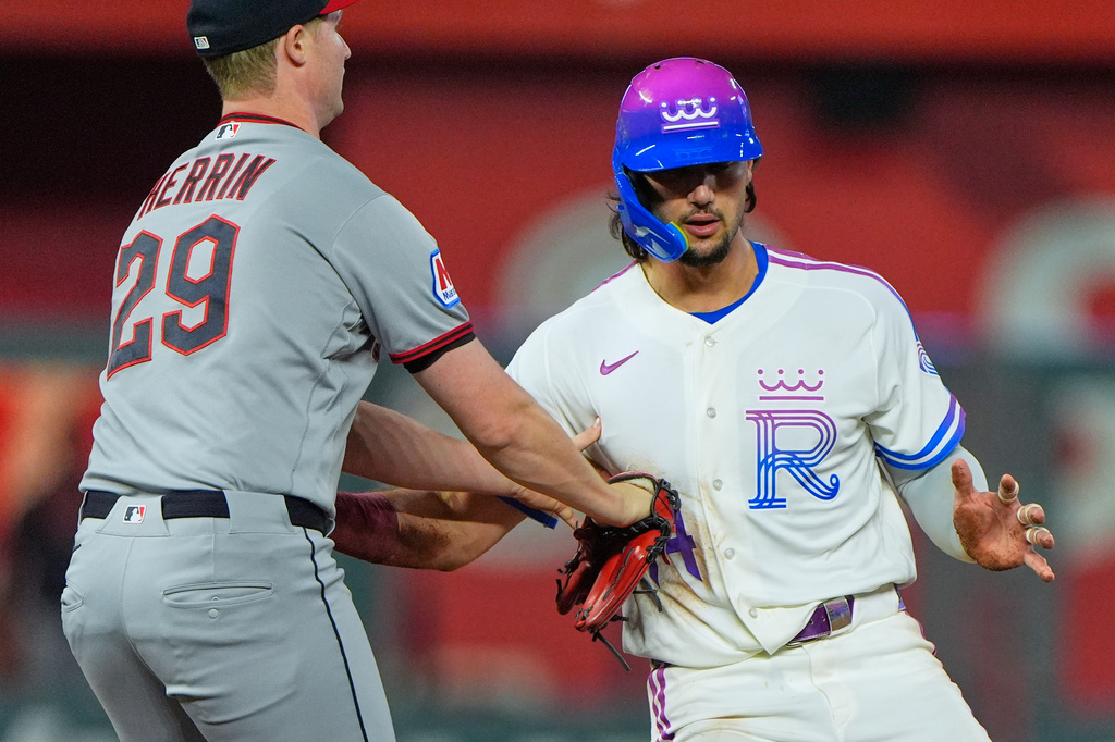 Kansas City Royals' Jac Caglianone is tagged out off base by Cleveland Guardians pitcher Tim Herrin as he tried to advance on a single by Maikel Garcia during the fourth inning of a baseball game Friday, Sept. 25, 2026, in Kansas City, Mo. (AP Photo/Charlie Riedel)
