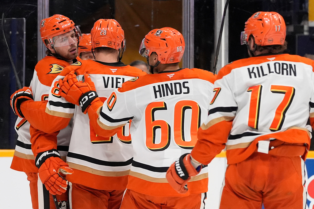 Anaheim Ducks left wing Cutter Gauthier, left, celebrates his goal with teammates during the third period of an NHL hockey game against the Nashville Predators, Thursday, April 16, 2026, in Nashville, Tenn. (AP Photo/George Walker IV)