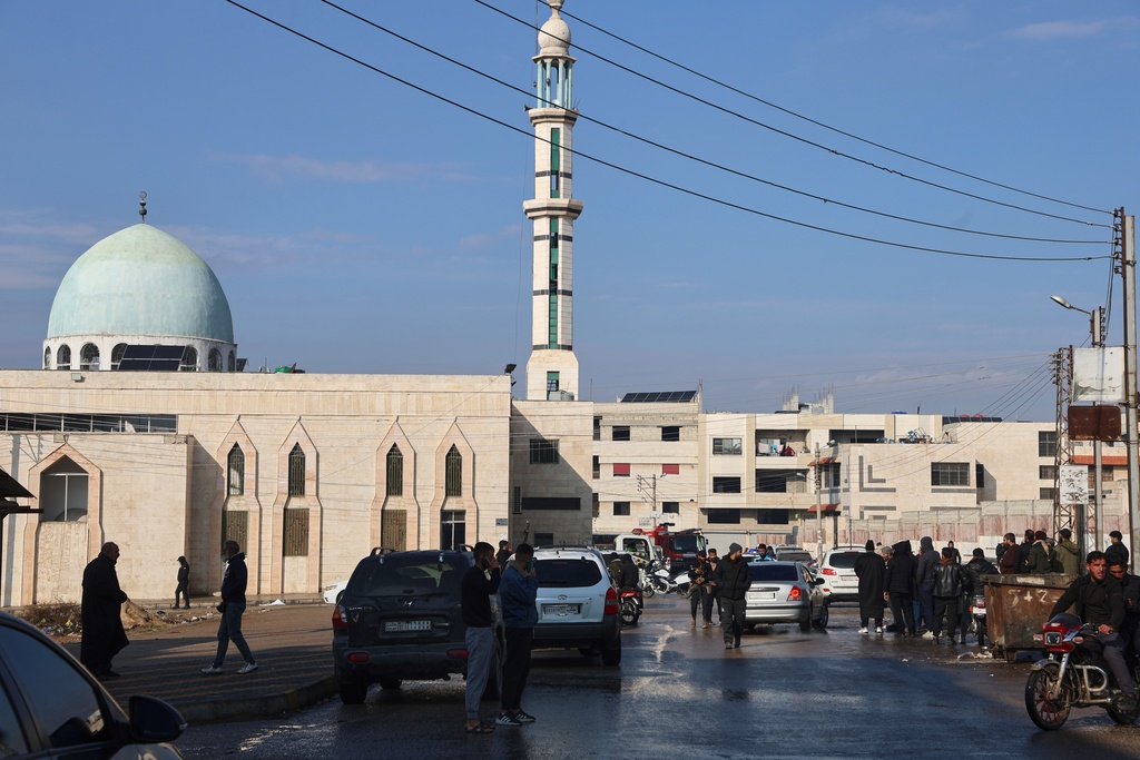 Syrian security forces secure the area outside the Imam Ali bin Abi Talib Mosque in the predominantly Alawite Wadi al-Dhahab neighborhood after an explosion inside the mosque, in Homs, Syria, Friday, Dec. 26, 2025. (AP Photo)