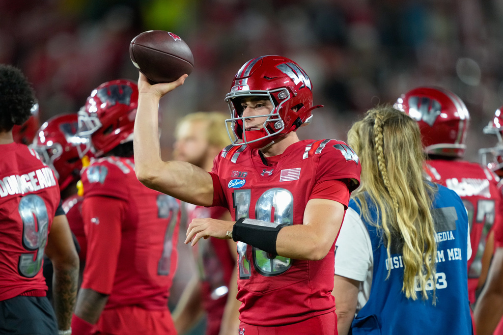 FILE - Wisconsin quarterback Ryan Hopkins (10) throws on the sidelines during the second half of an NCAA college football game against Notre Dame Sunday, Sept. 6, 2026, in Green Bay, Wis. (AP Photo/Kayla Wolf, File)