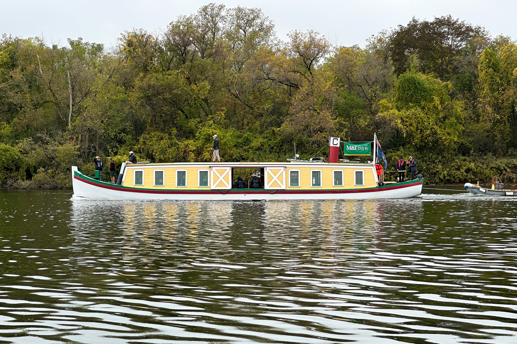 The Seneca Chief travels down the Mohawk River, Oct. 21, 2025, in Glenville, N.Y., commemorating New York Gov. DeWitt Clinton's inaugural 1825 journey along the Erie Canal. (AP Photo/Michael Hill)