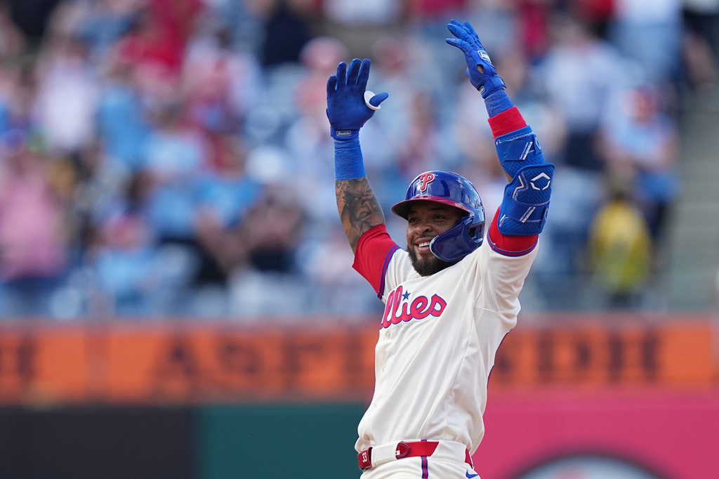 Philadelphia Phillies' Edmundo Sosa reacts from second base after hitting a two-run single off of Washington Nationals pitcher Cole Henry during the ninth inning of a baseball game, Wednesday, April 1, 2026, in Philadelphia. (AP Photo/Matt Rourke)