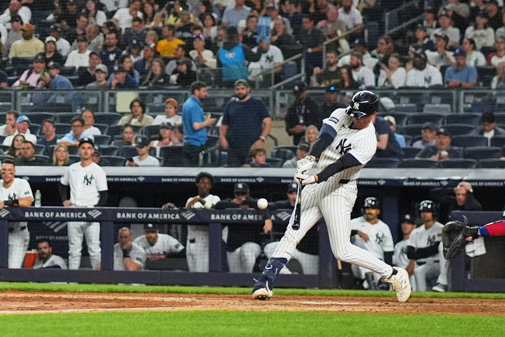 New York Yankees' Ryan McMahon hits a single during the seventh inning of a baseball game against the Texas Rangers Tuesday, May 5, 2026, in New York. (AP Photo/Frank Franklin II)