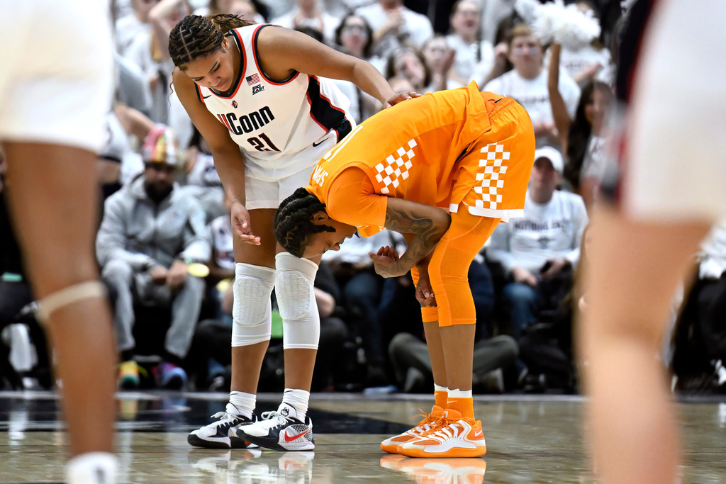 UConn forward Sarah Strong (21) checks on Tennessee forward Zee Spearman, right, in the second half of an NCAA college basketball game, Sunday, Feb. 1, 2026, in Hartford, Conn. (AP Photo/Jessica Hill)