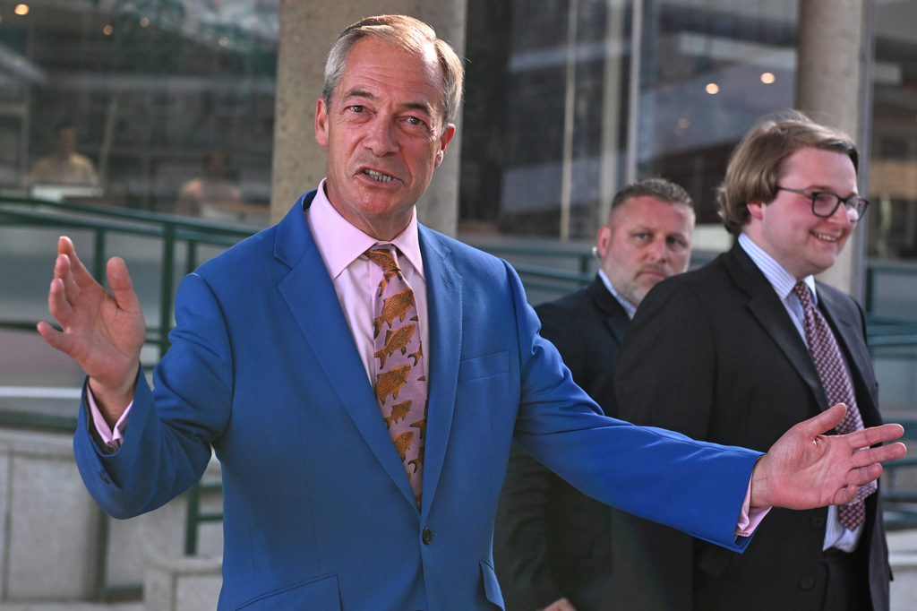 Britain's Reform UK leader Nigel Farage leaves Milbank Tower after he said he'll quit his Parliament seat and seek reelection in London, Tuesday, July 7, 2026.(AP Photo/Thomas Krych)