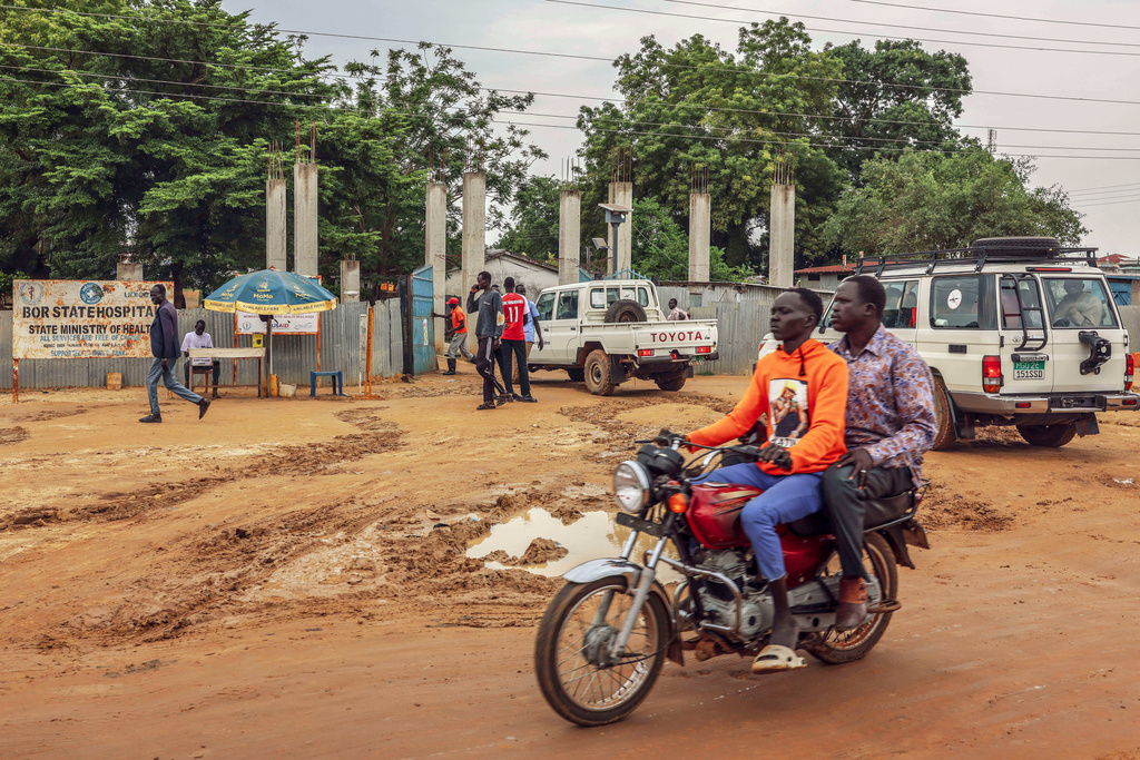 FILE - Motorists pass outside Bor State Hospital in Bor, South Sudan, Monday, Aug. 18, 2025. (AP Photo/Caitlin Kelly, File)