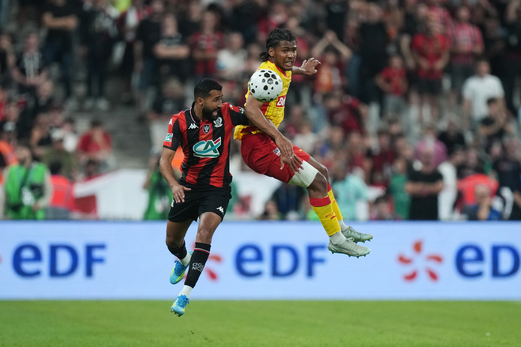Lens' Kyllian Antonio, right, challenges for the ball with Nice's Ali Abdi, left, during the French Cup soccer final between Nice and Lens in Saint-Denis, outside Paris, Friday, May 22, 2026. (AP Photo/Thibault Camus)