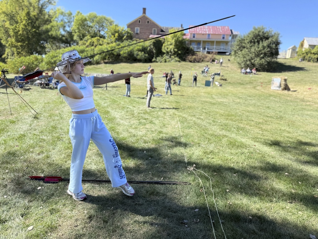 12-year-old Ava Nolf of Clinton, Connecticut practices throwing an atlatl during the Northeastern Atlatl Championship in Addison, Vt. on Saturday, Sept. 20, 2025. (AP Photo/Amanda Swinhart)