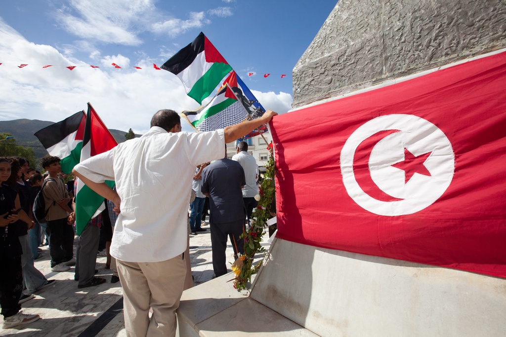 Demonstrators gather at a memorial site honoring the victims of the 1985 Israeli attack on Palestine Liberation Organization's headquarters, in Hammam Chott outside Tunisia's capital, Wednesday, Oct. 1, 2025. (AP Photo/Ons Abid)