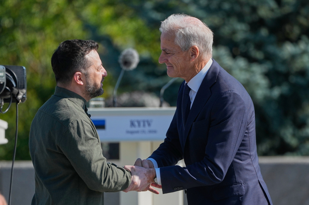 FILE - Ukraine's President Volodymyr Zelenskyy greets Norway's Prime Minister Jonas Gahr Stoere ahead of the flag-raising ceremony to mark the National Flag Day in Kyiv, Ukraine, on Aug. 23, 2026. (AP Photo/Efrem Lukatsky, File)