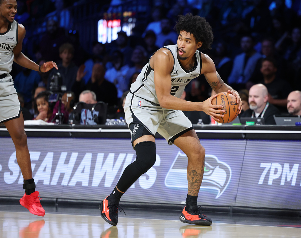 San Antonio Spurs guard Dylan Harper (2) sets to play the ball in the first half of an NBA Cup semifinals basketball game against the Oklahoma City Thunder, Saturday, Dec. 13, 2025, in Las Vegas. (AP Photo/Ronda Churchill)