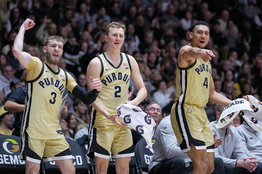FILE - Purdue guard Braden Smith (3), guard Fletcher Loyer (2) and forward Trey Kaufman-Renn (4) celebrate on the bench in the second half of an NCAA college basketball game against Nebraska in West Lafayette, Ind., Sunday, Jan. 12, 2025. (AP Photo/Michael Conroy, File) FILE - Purdue guard Braden Smith (3), guard Fletcher Loyer (2) and forward Trey Kaufman-Renn (4) celebrate on the bench in the second half of an NCAA college basketball game against Nebraska in West Lafayette, Ind., Sunday, Jan. 12, 2025. (AP Photo/Michael Conroy, File)