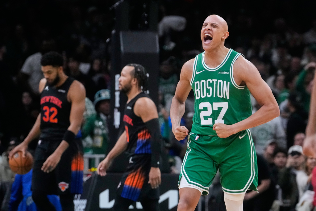 Boston Celtics guard Jordan Walsh (27) celebrates after a basket against the New York Knicks during the second half of an NBA basketball game, Tuesday, Dec. 2, 2025, in Boston. (AP Photo/Charles Krupa)