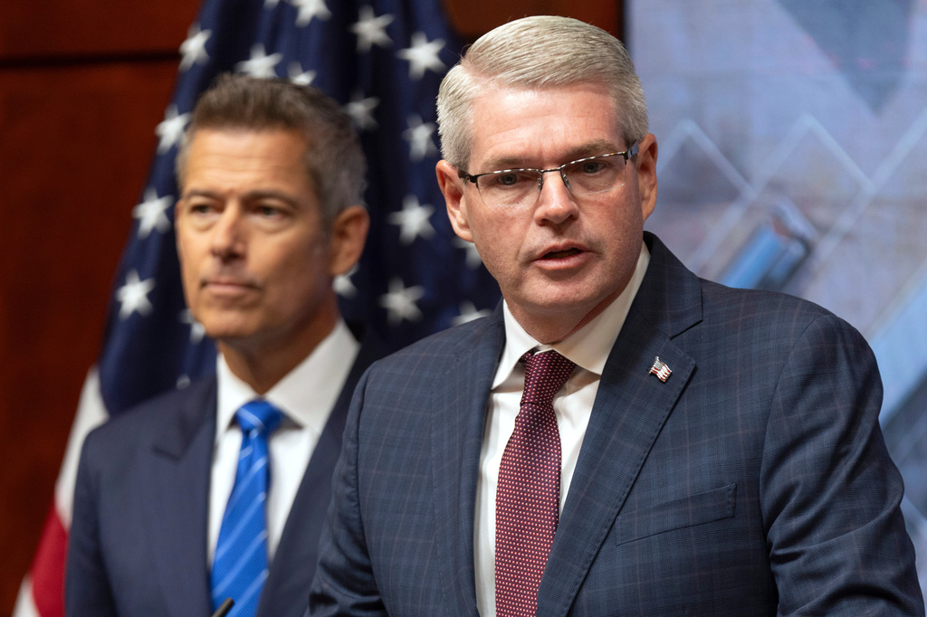 Derek Barrs, Administrator of the Federal Motor Carrier Safety Administration, speaks as Transportation Secretary Sean Duffy listens during a news conference at the Department of Transportation in Washington, Friday, Dec. 12, 2025. (AP Photo/Mark Schiefelbein)