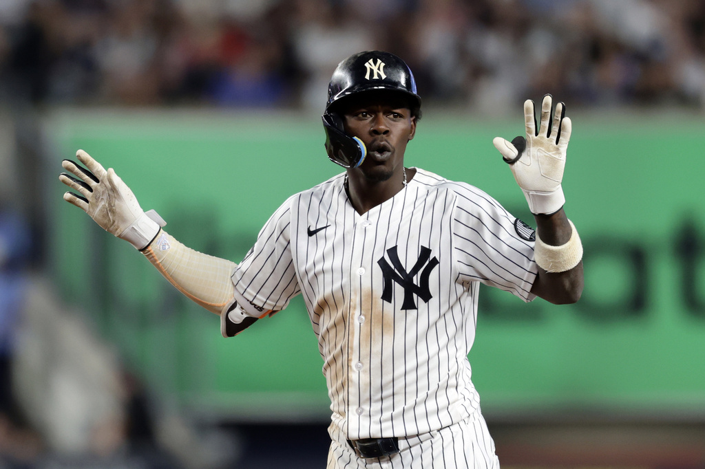 New York Yankees' Jazz Chisholm Jr. reacts after hitting a foul ball during the sixth inning of a baseball game against the Boston Red Sox, Friday, June 5, 2026, in New York. (AP Photo/Adam Hunger)