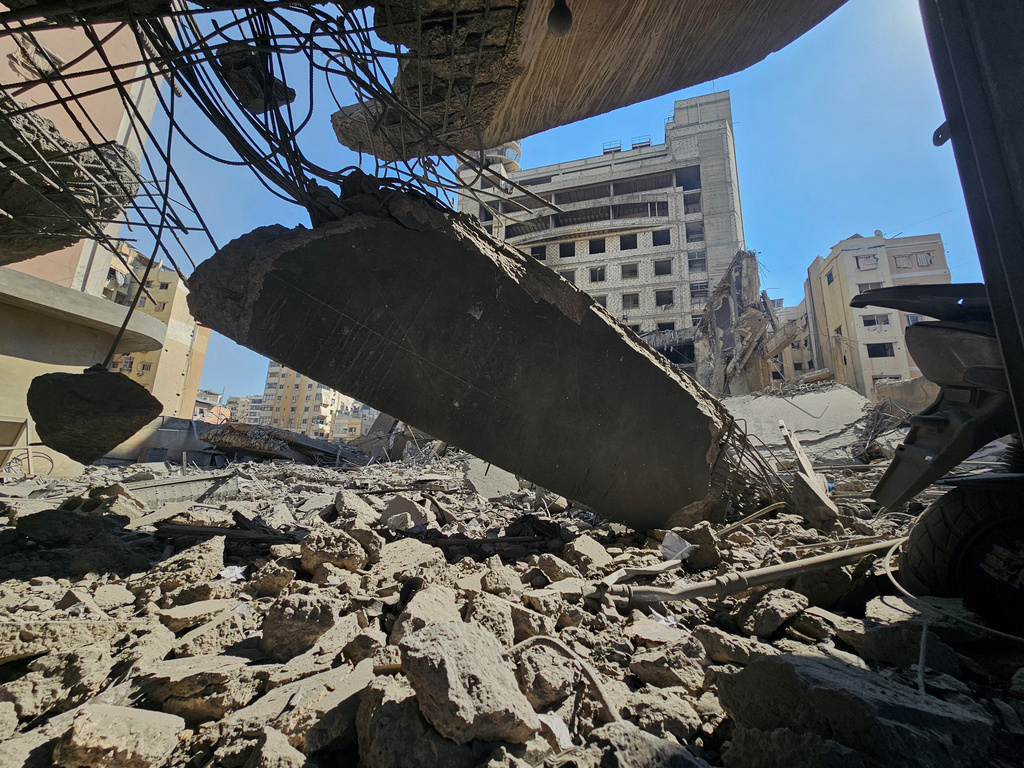 FILE - Debris cover the site of Hezbollah's Al-Manar TV headquarters after it was hit in an Israeli airstrike on Dahiyeh, a southern suburb of Beirut, Lebanon, Tuesday, March 3, 2026. (AP Photo/Hassan Ammar, File)
