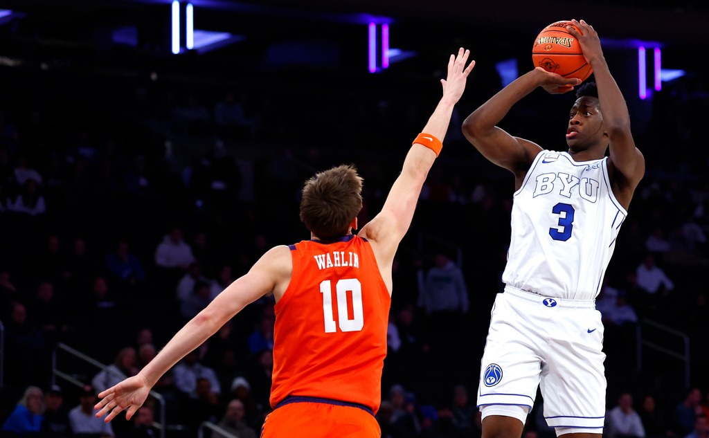 BYU forward AJ Dybantsa (3) shoots over Clemson forward Jake Wahlin (10) during the first half of an NCAA college basketball game, Tuesday, Dec. 9, 2025, in New York. (AP Photo/Noah K. Murray)
