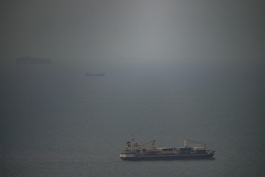 A cargo ship sails in the Persian Gulf toward the Strait of Hormuz, Wednesday, April 22, 2026. (AP Photo)
