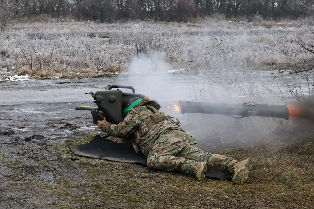 In this photo provided by Ukraine's 65th Mechanized Brigade press service, a soldier fires a MILAN, a Franco-German anti-tank missile system, during a drill close to the frontline on the site of heavy battles with the Russian troops in the Zaporizhzhia region, Ukraine, Sunday, Jan. 4, 2026. (Andriy Andriyenko/Ukraine's 65th Mechanized Brigade via AP)