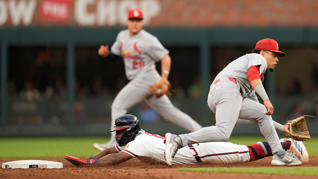 Atlanta Braves' Jorge Mateo (2) steals second base against St. Louis Cardinals shortstop Masyn Winn (0) in the third inning of a baseball game, Tuesday, June 30, 2026, in Atlanta. (AP Photo/Mike Stewart)