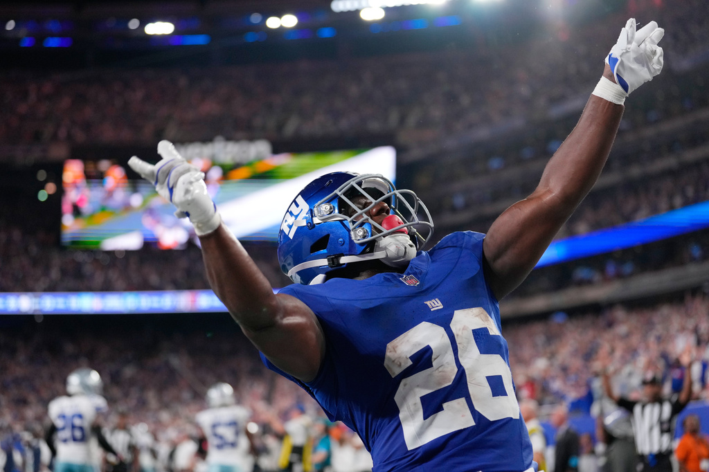 New York Giants running back Devin Singletary reacts after scoring a touchdown against the Dallas Cowboys during the second half of an NFL football game Sunday, Sept. 13, 2026, in East Rutherford, N.J. (AP Photo/Yuki Iwamura)