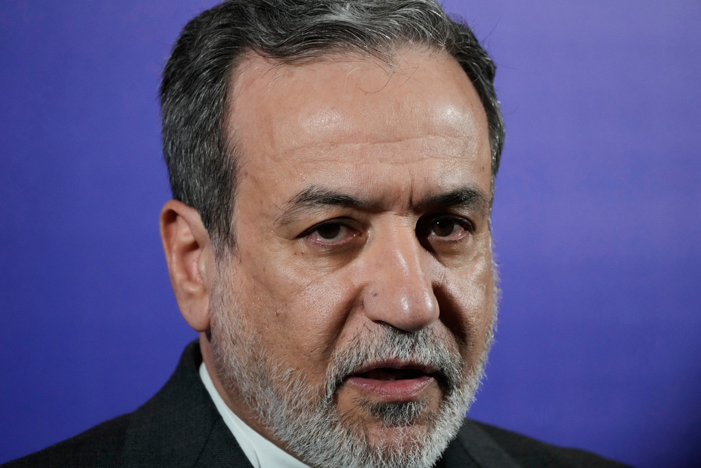 Iranian Foreign Minister Abbas Araghchi speaks in a new briefing after attending a conference titled "International Law Under Assault: Aggression and Self-Defense," in Tehran, Iran, Sunday, Nov. 16, 2025. (AP Photo/Vahid Salemi)