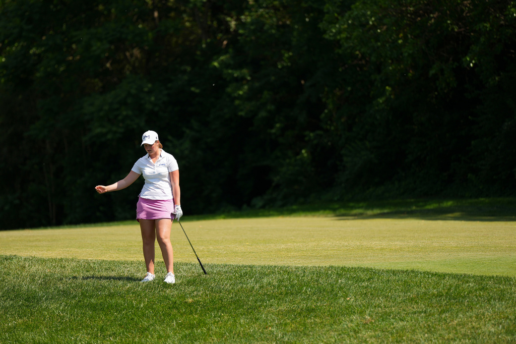 Lottie Woad reacts hitting on the sixth hole during the final round of the Queen City Championship LPGA golf tournament at Maketewah Country Club, Sunday, May 17, 2026, in Cincinnati. (AP Photo/Jeff Dean)