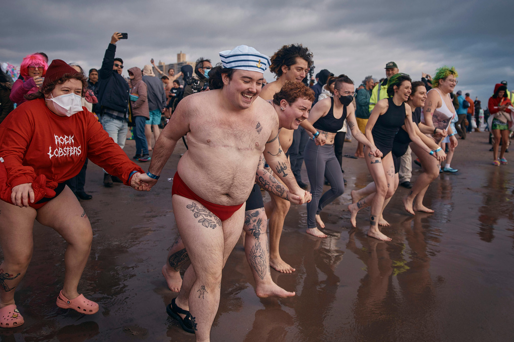FILE - Revelers enter the cold water during the annual Polar Bear Plunge on New Year's Day, Jan. 1, 2025, in New York. (AP Photo/Andres Kudacki, file)