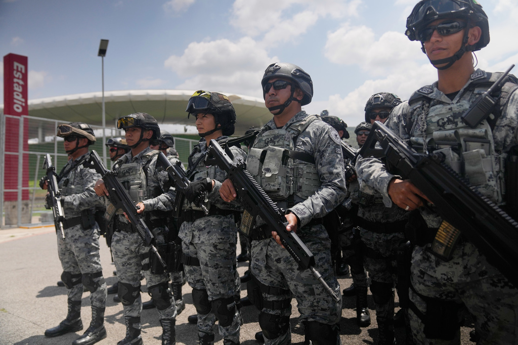 National Guard deploy outside the stadium that will host FIFA World Cup matches in Guadalajara, Mexico, Tuesday, June 9, 2026. (AP Photo/Matias Delacroix)